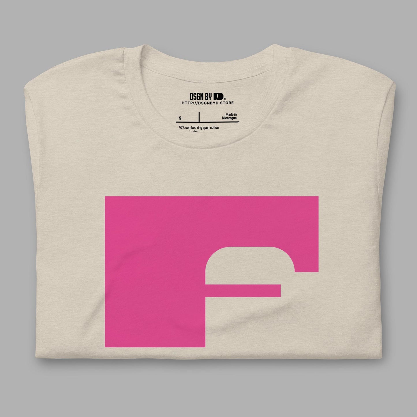 A folded beige cotton unisex graphic tee with letter F.