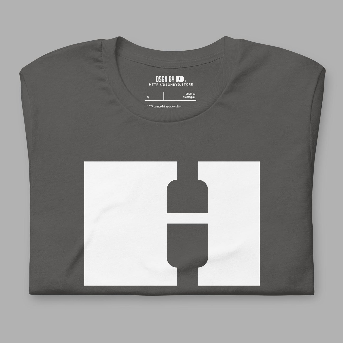 A folded grey cotton unisex graphic tee with letter H.