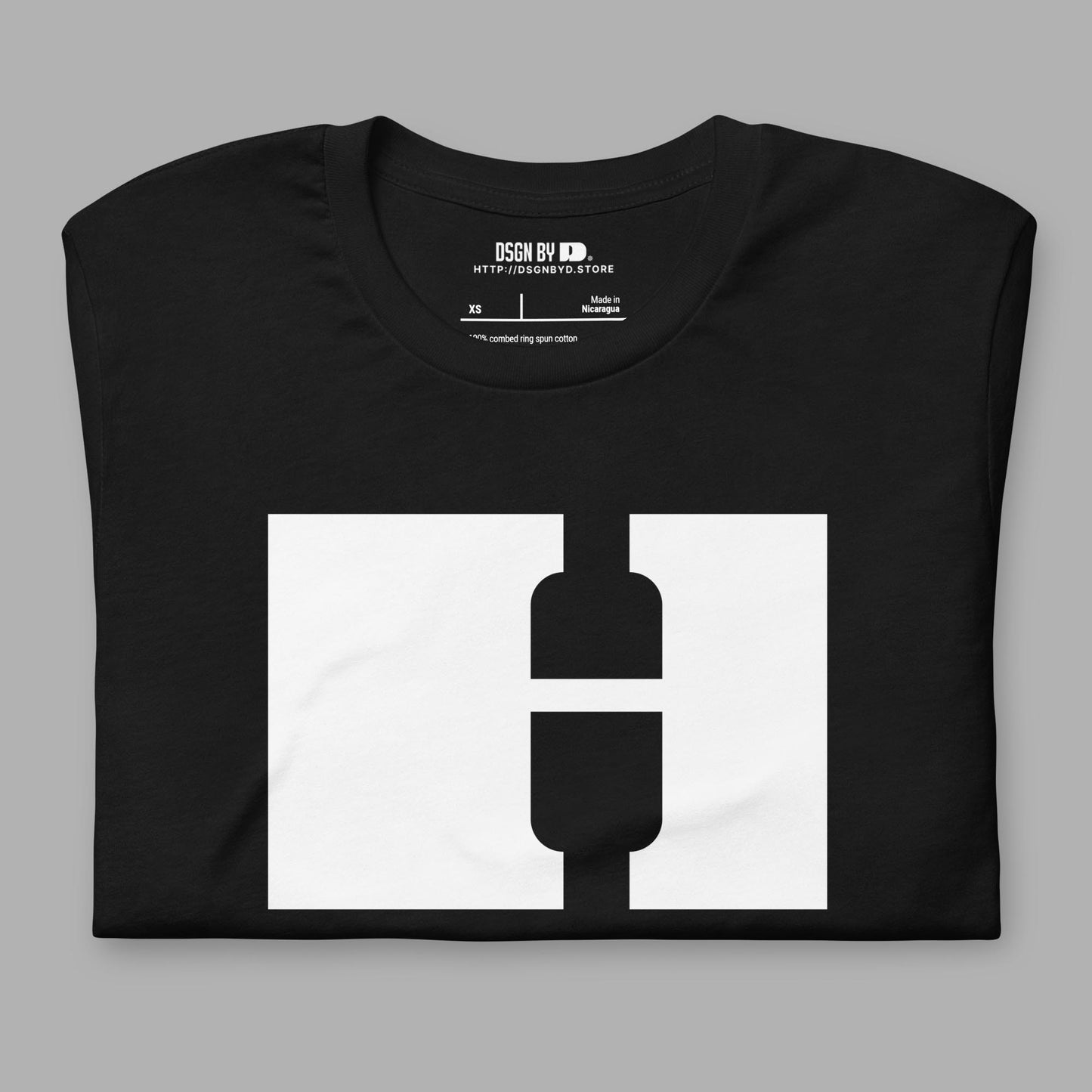 A folded black cotton unisex graphic tee with letter H.
