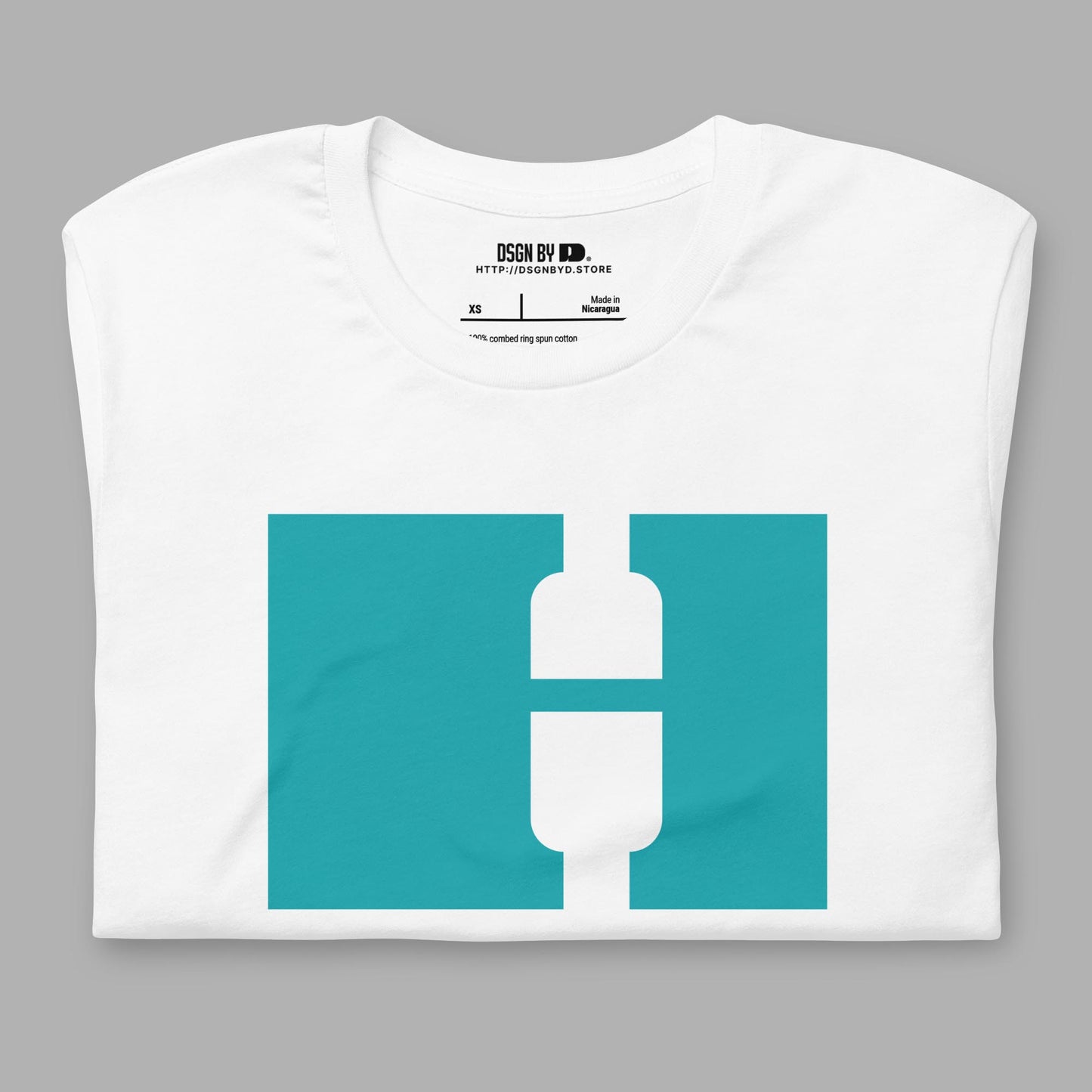 A folded white cotton unisex graphic tee with letter H.