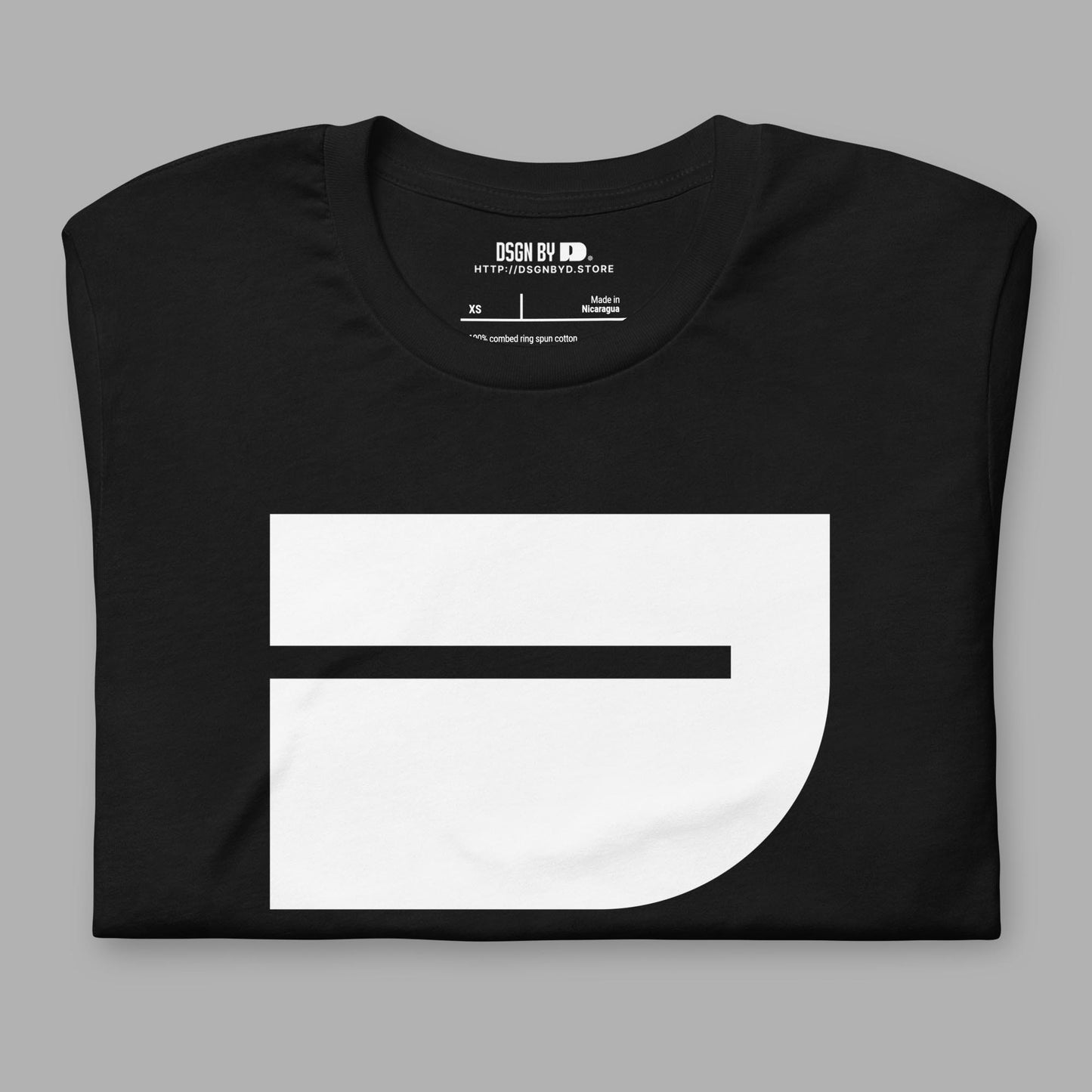 A folded black cotton unisex graphic tee with letter J.