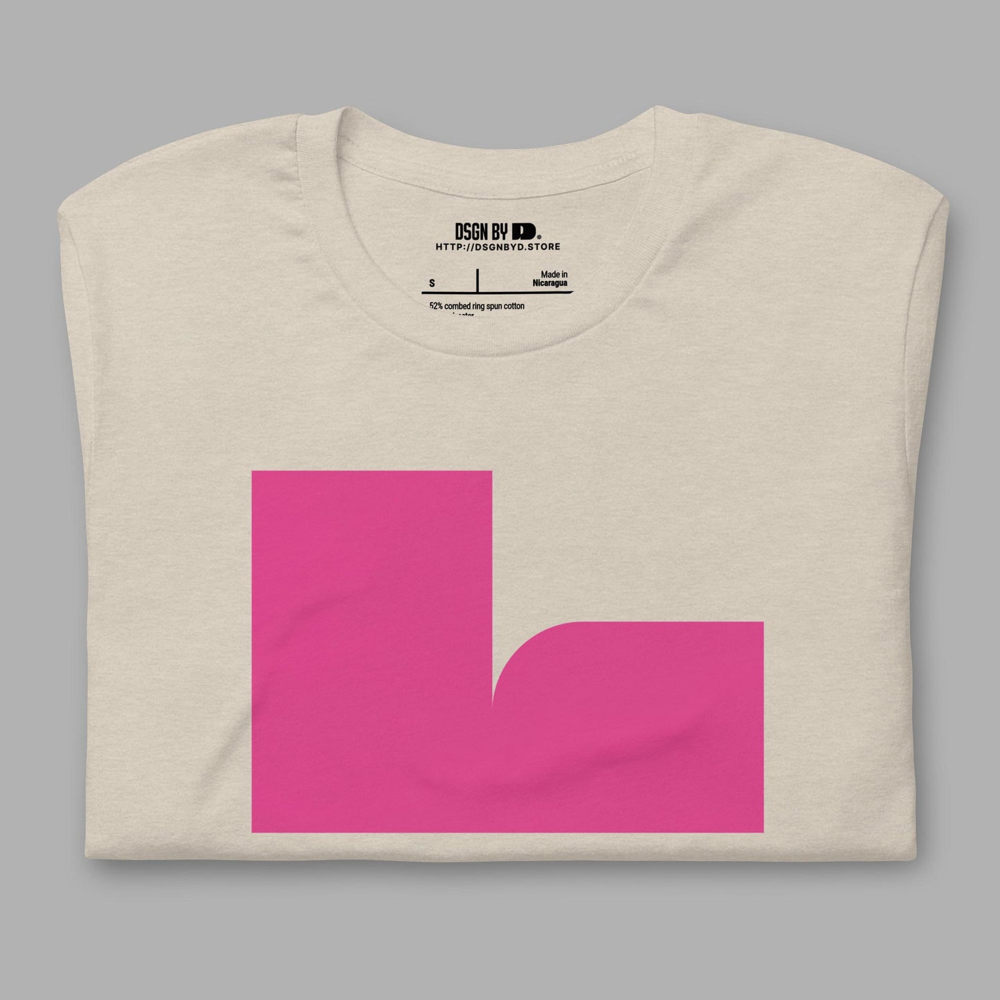 A folded beige cotton unisex graphic tee with letter L.