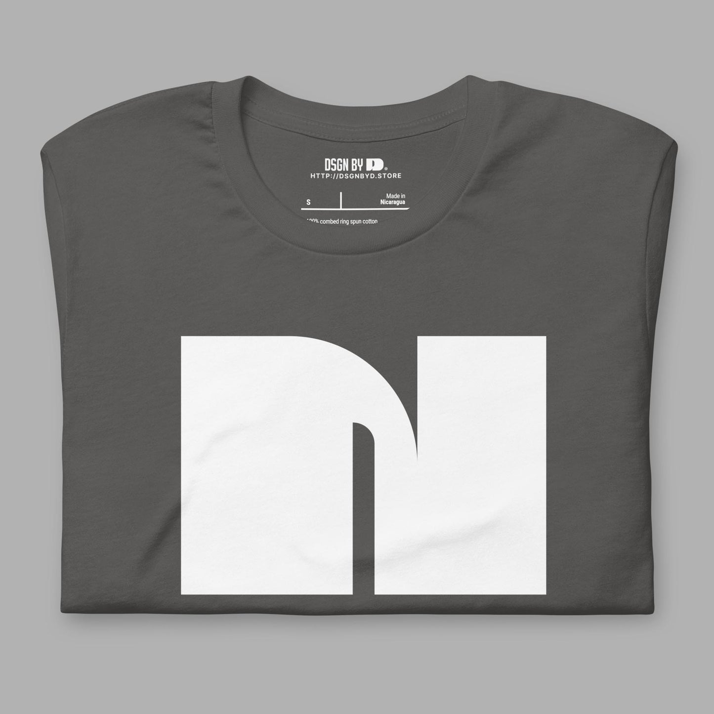 A folded grey cotton unisex graphic tee with letter N.