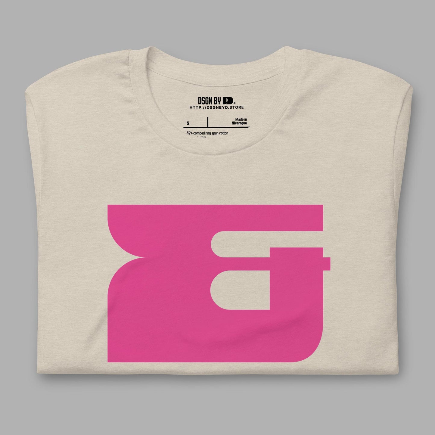 A folded beige cotton unisex graphic tee.