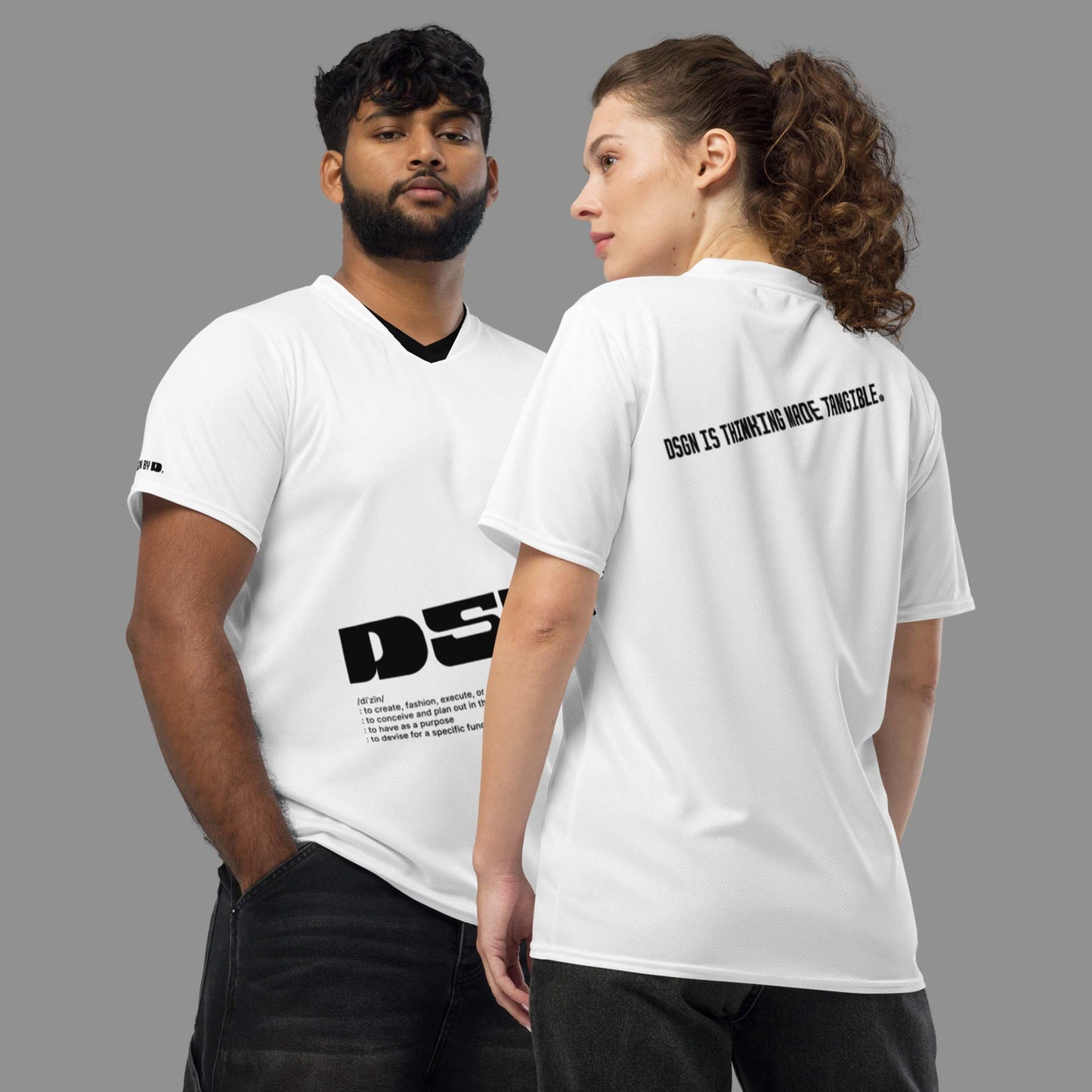 A couple wearing white sports jersey with "Design is thinking made tangible" printed on the jersey.