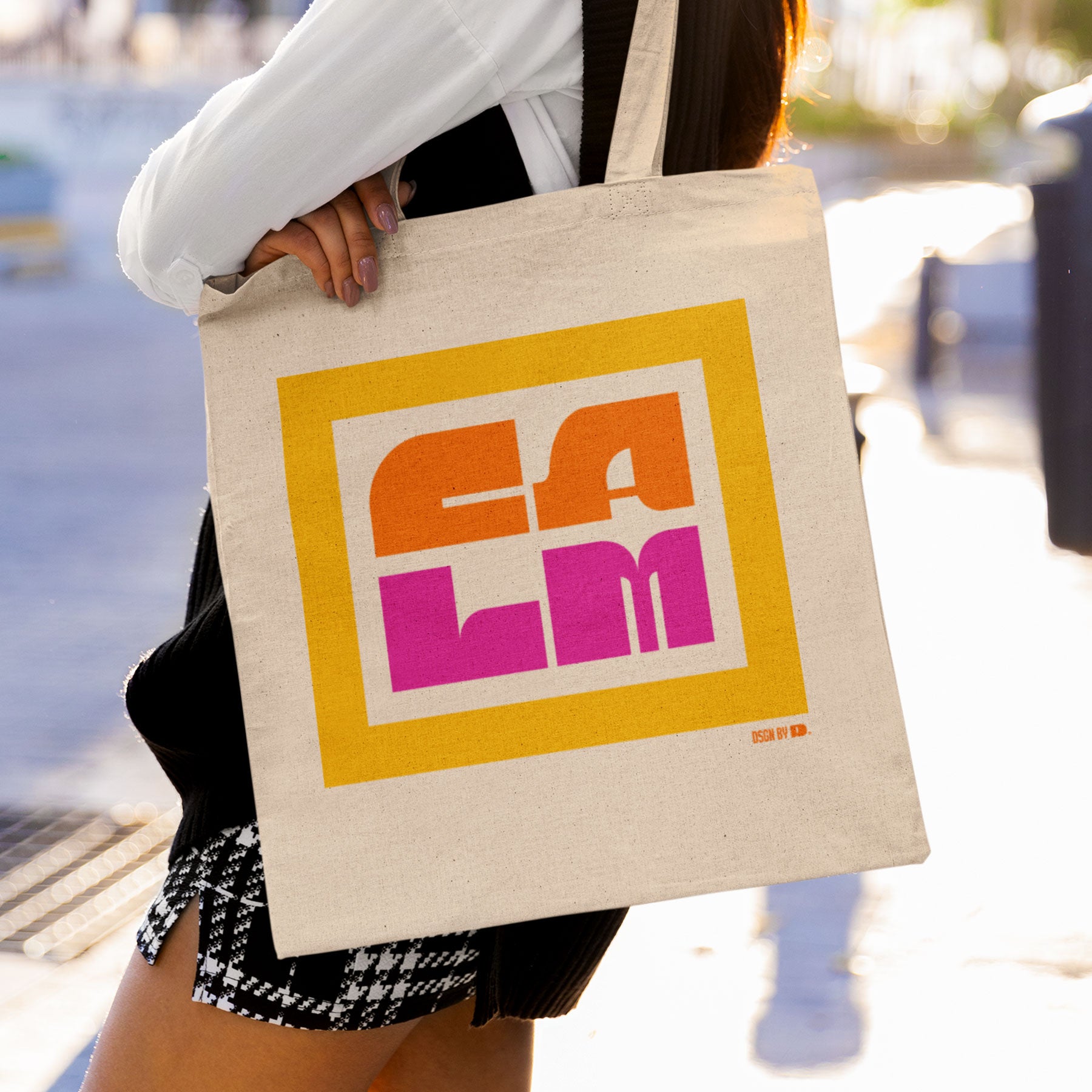 Woman with a cotton canvas tote bag.
