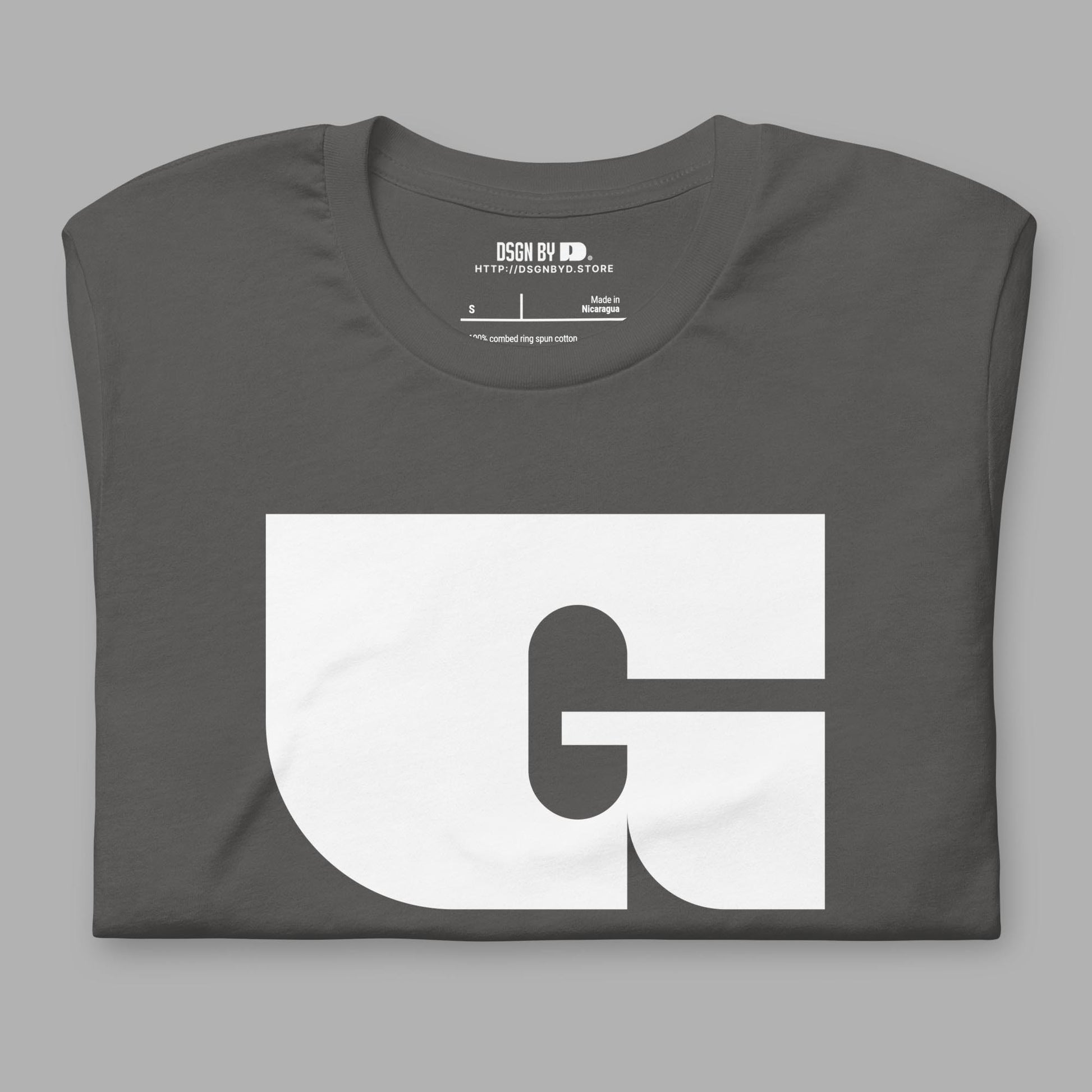 A folded grey cotton unisex graphic tee with letter G.