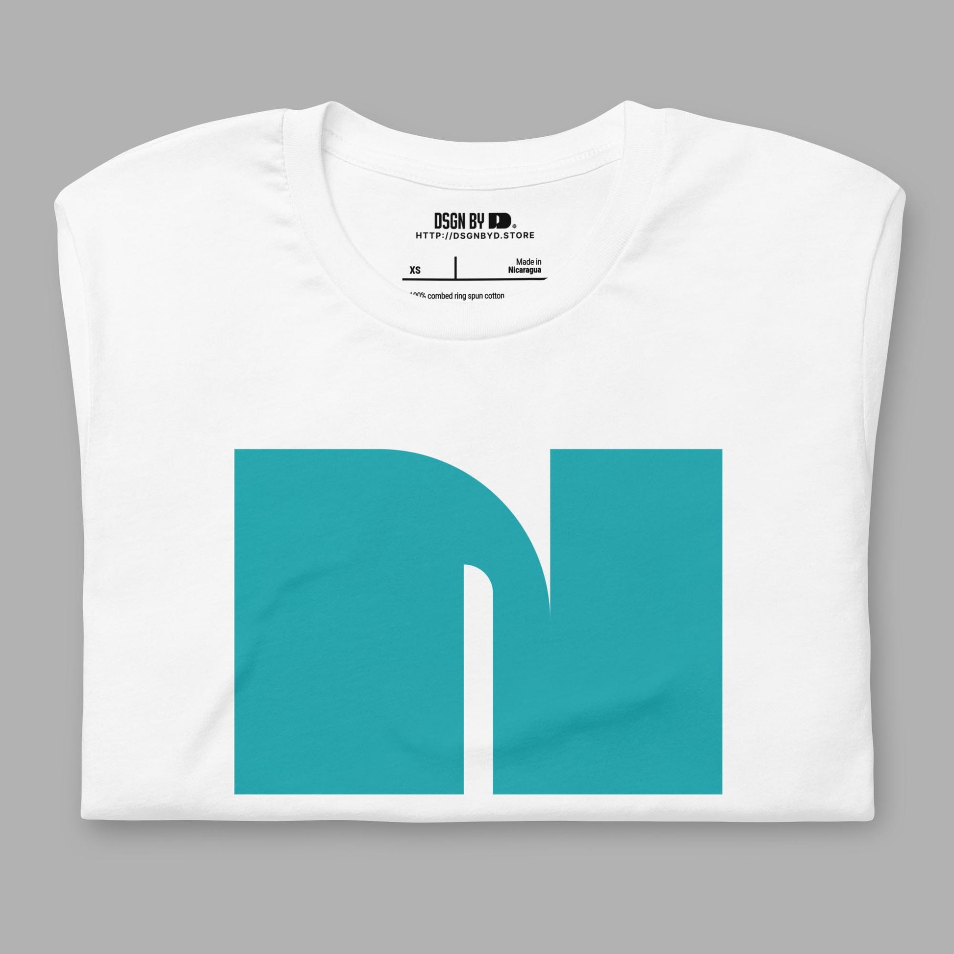 A folded white cotton unisex graphic tee with letter N.