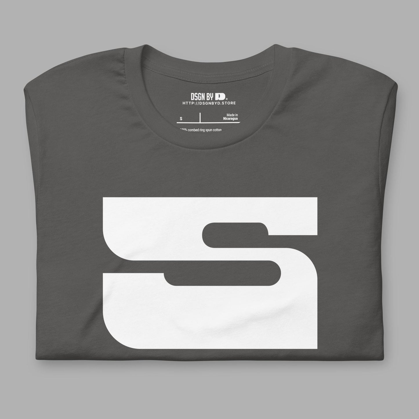 A folded grey cotton unisex graphic tee with letter S.