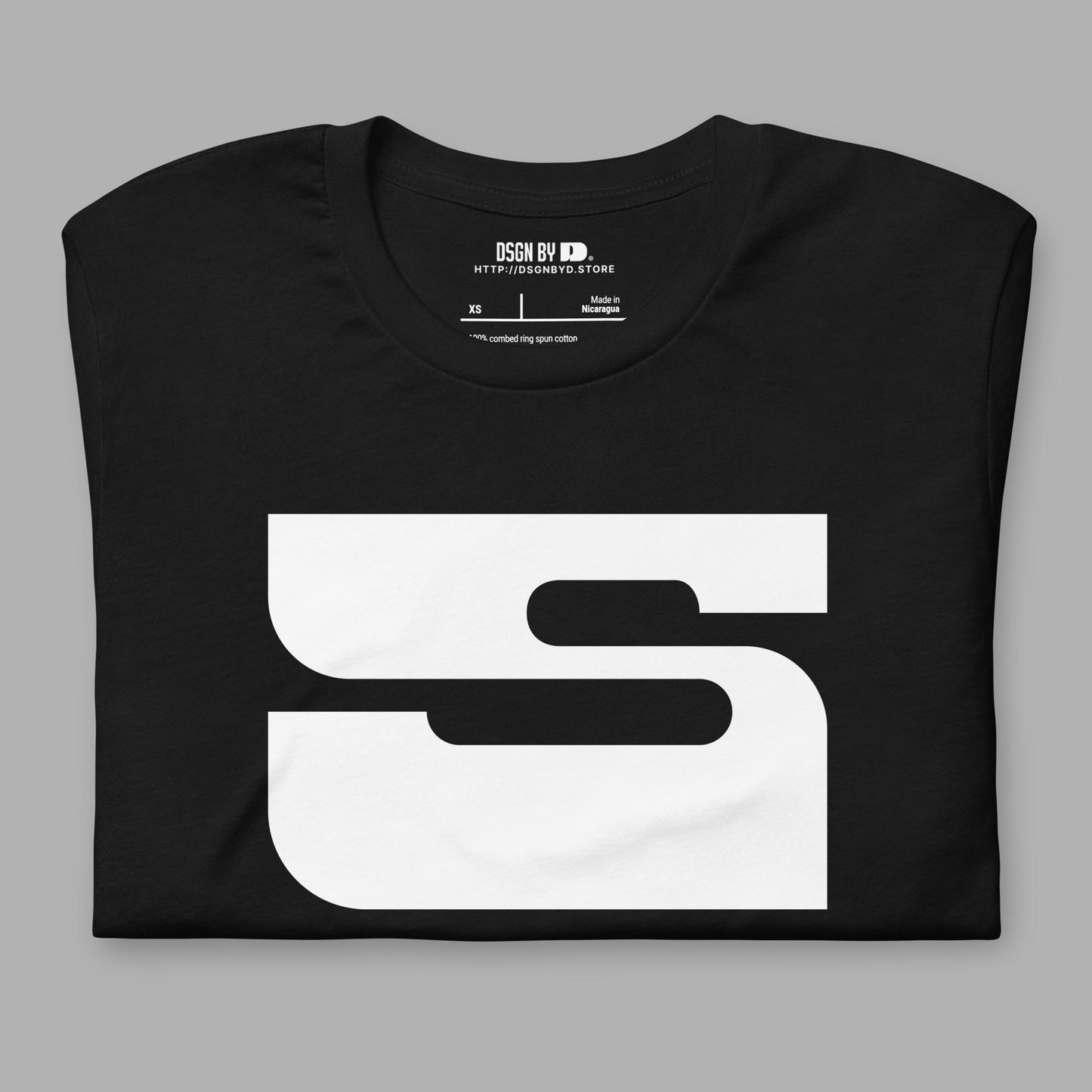 A folded black cotton unisex graphic tee with letter S.