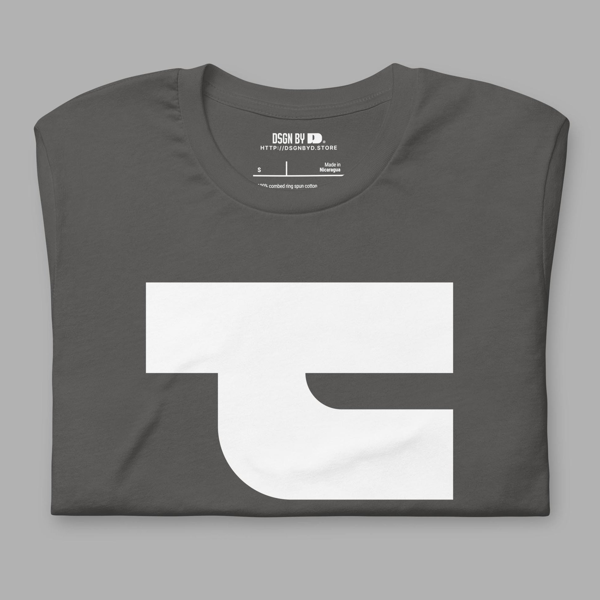 A folded grey cotton unisex graphic tee with letter T.