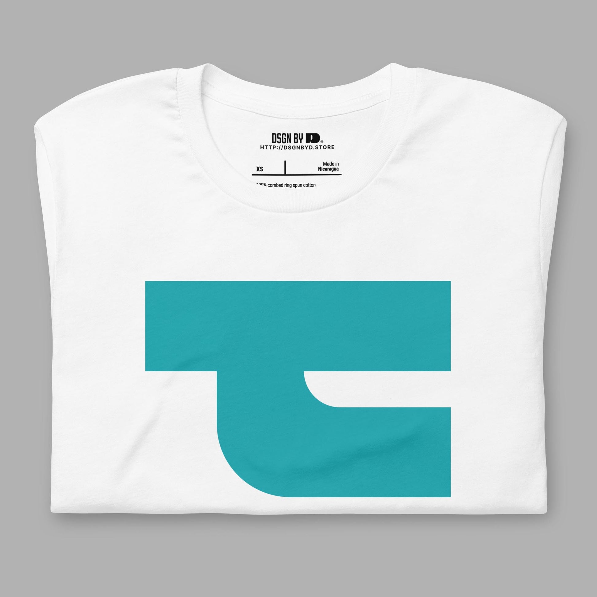 A folded white cotton unisex graphic tee with letter T.