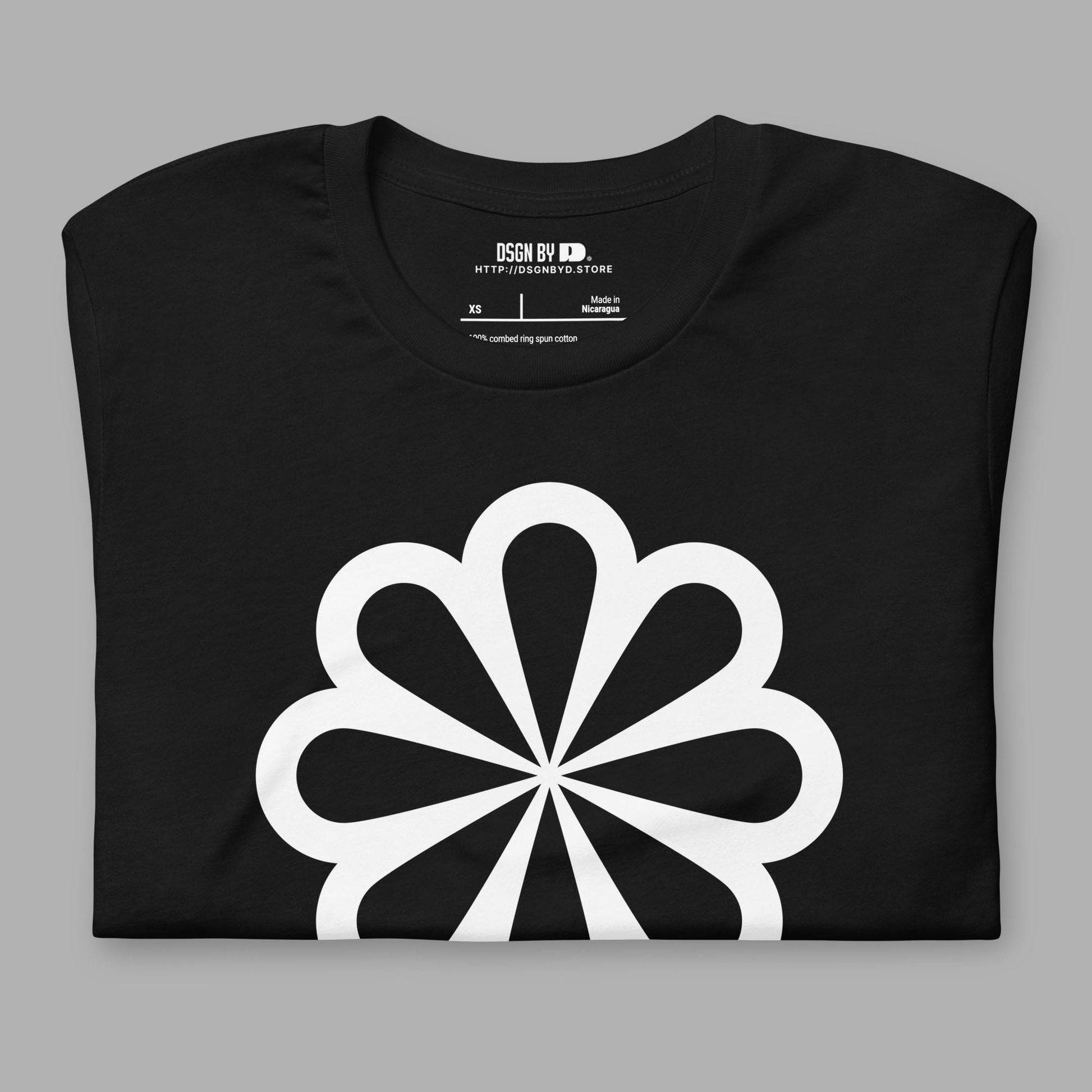 A folded black cotton unisex graphic tee.