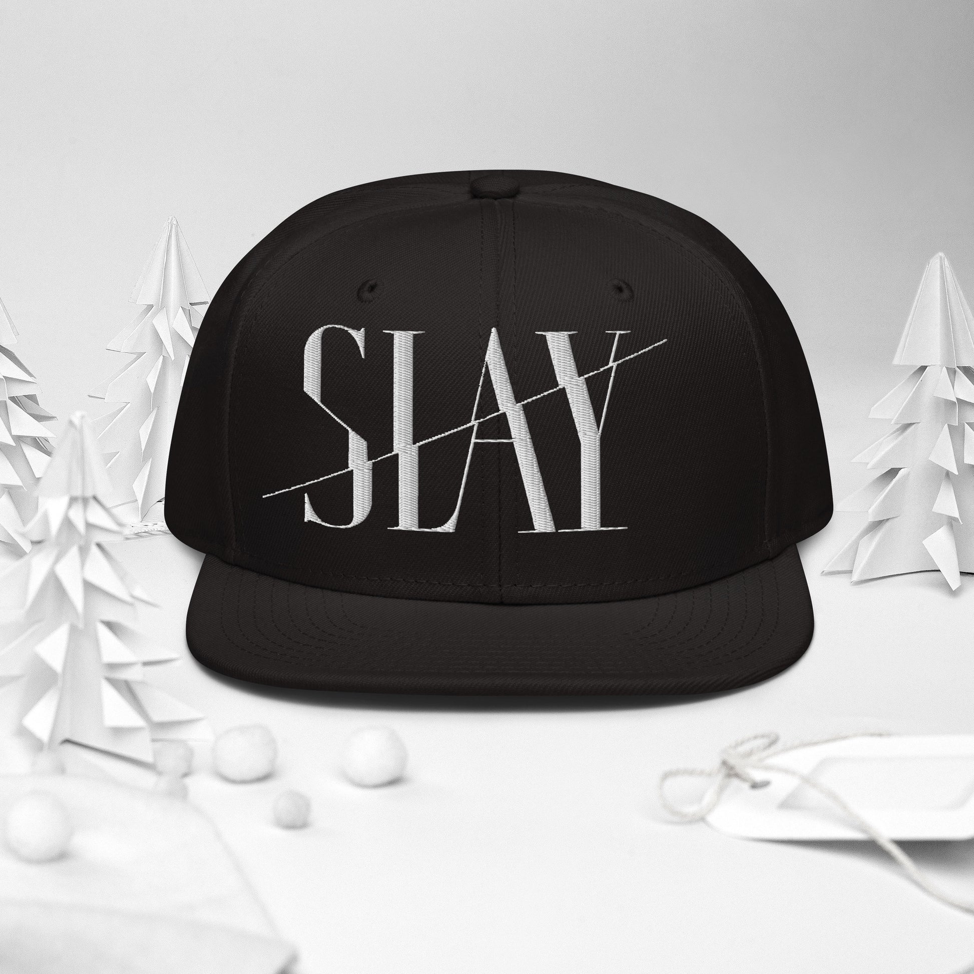 A black Snapback Hat with the word "SLAY" embroidered on the front.