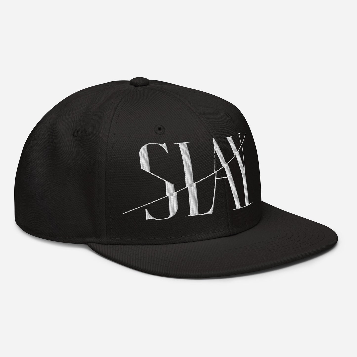 Side view of a black Snapback Hat with the word "SLAY" embroidered on the front.