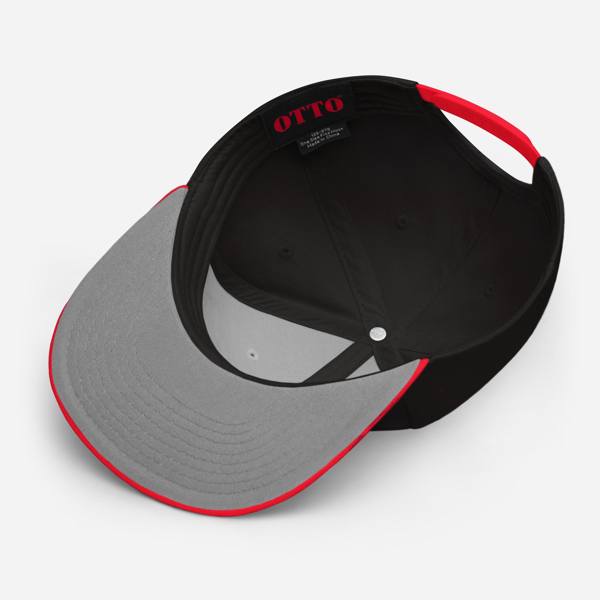 Flip side of a black and red Snapback Hat with the word "SLAY" embroidered on the front.