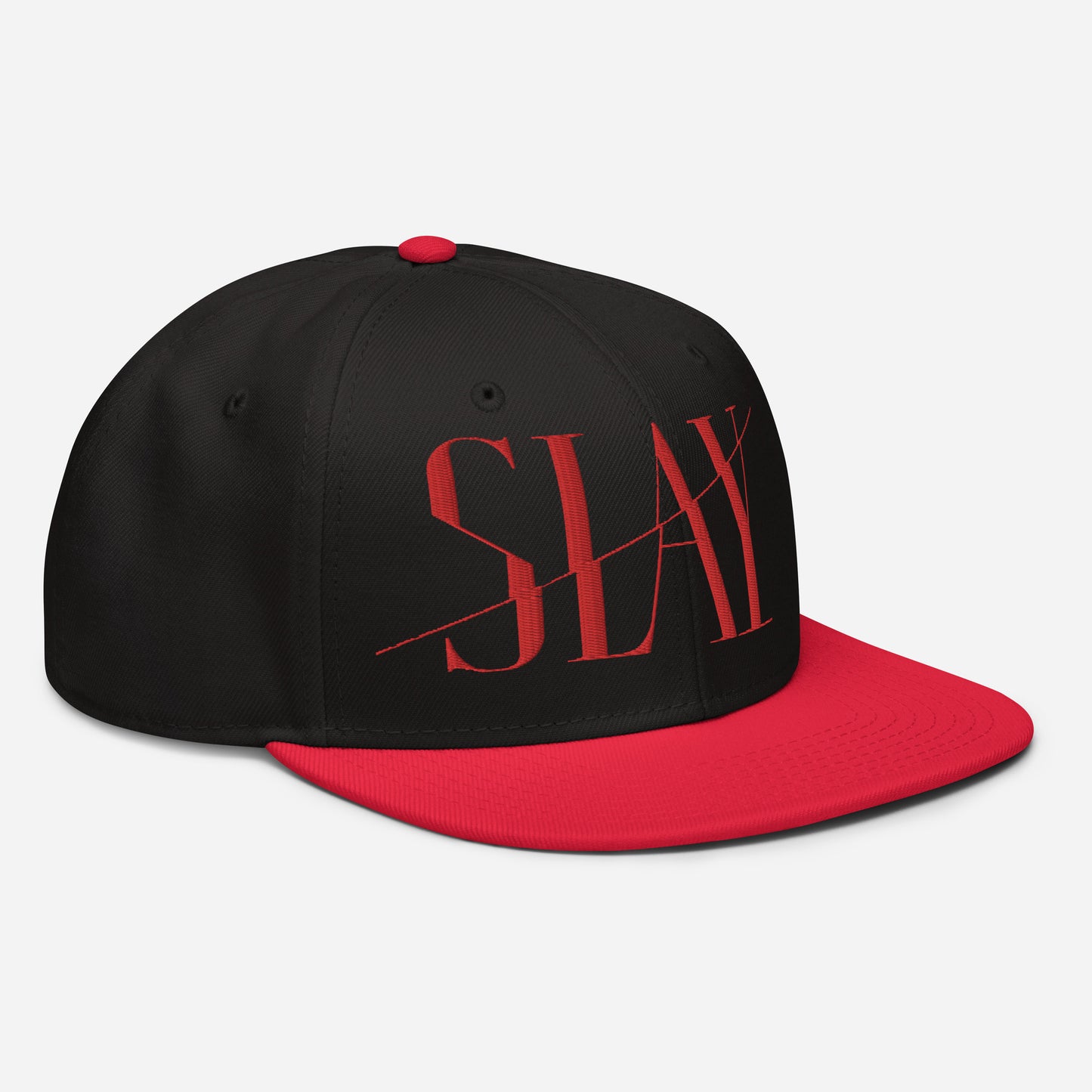 Side view of a black and red Snapback Hat with the word "SLAY" embroidered on the front.