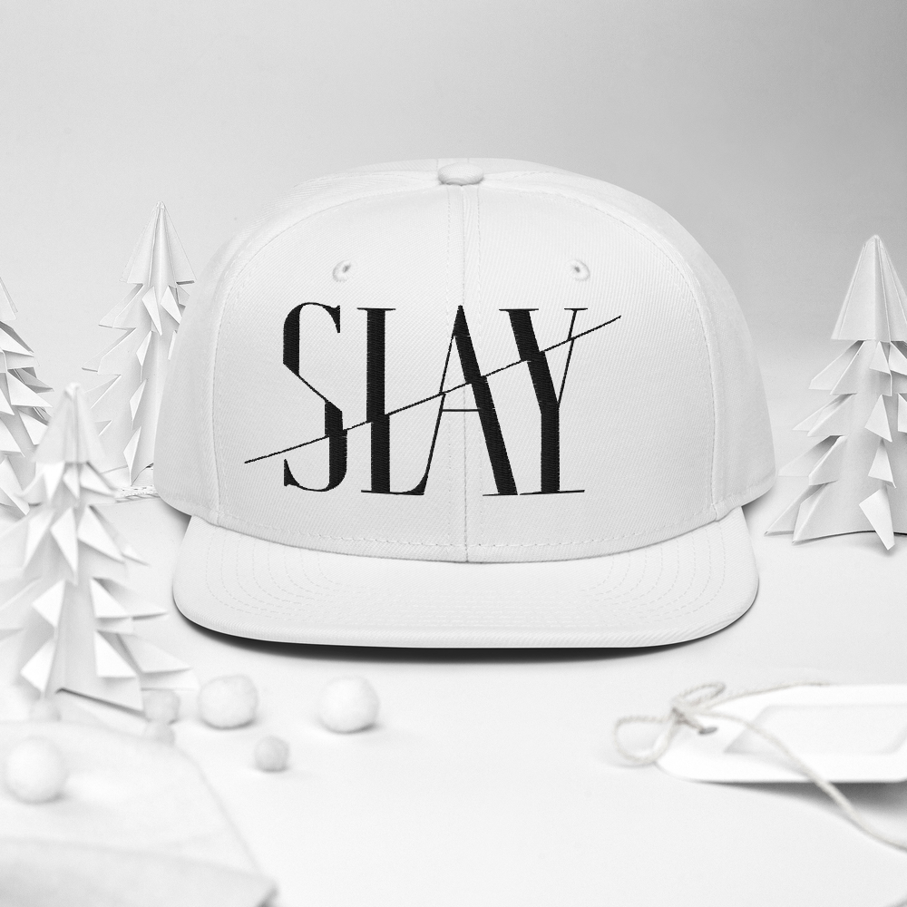 A white Snapback Hat with the word "SLAY" embroidered on the front. 